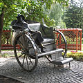 Metal sculpture of Gyula Krúdy Hungarian writer, sitting on a carriage - Siófok, Hungría